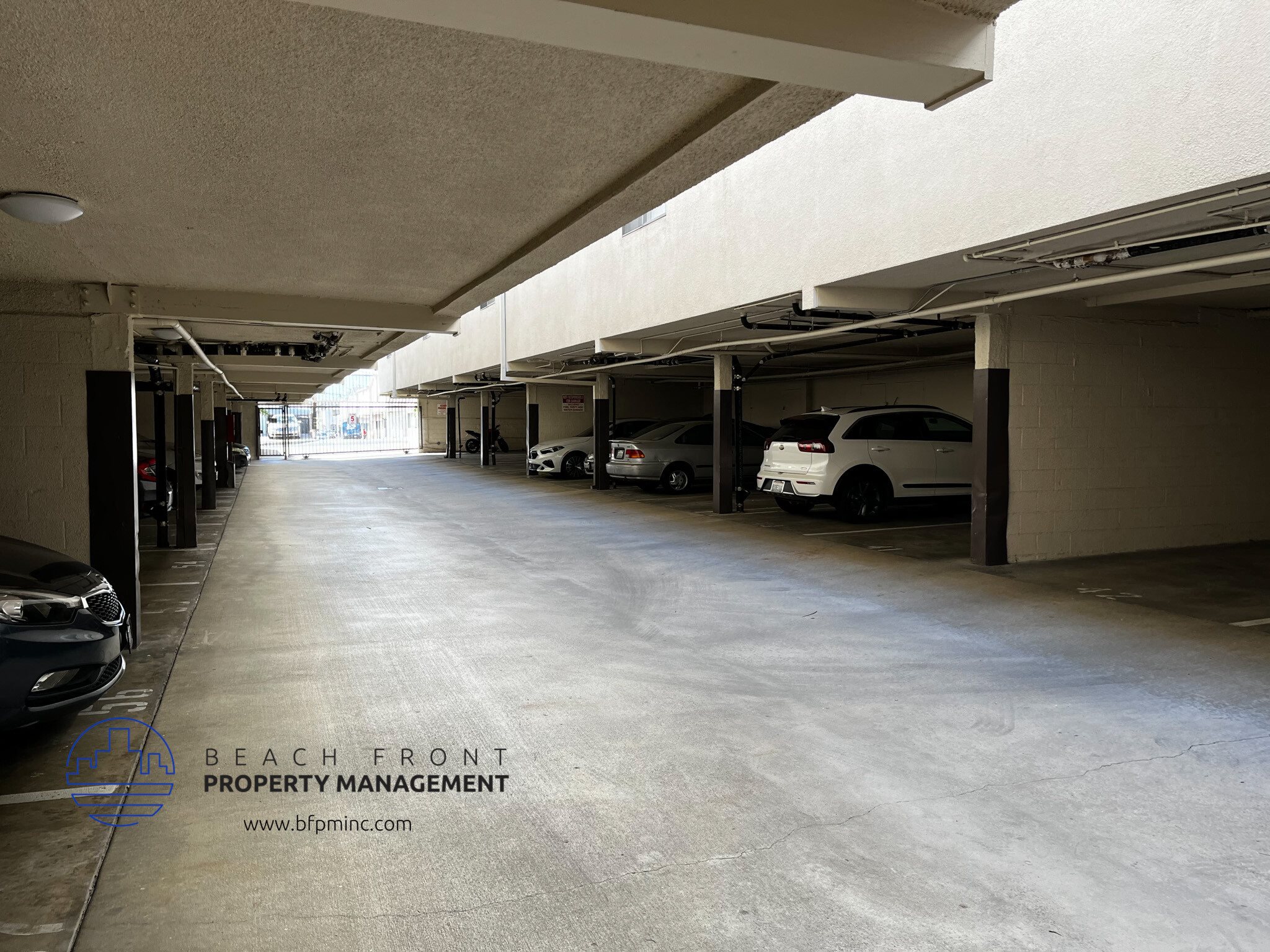 an empty parking garage at the beachfront property management building